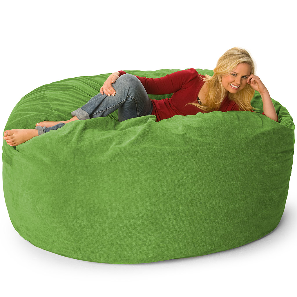 A girl relaxing on a blue, 5 ft fombag